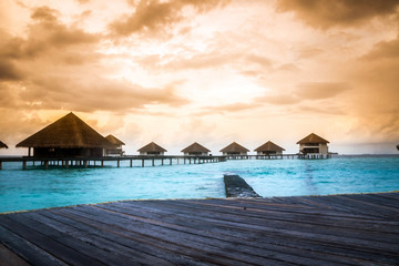 Over water bungalows with steps into amazing green lagoon