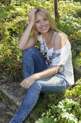 Beautiful woman in summer forest