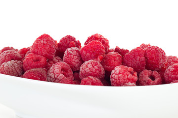 Some delicate frozen red raspberries