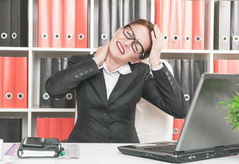 Business woman with pain in her neck and head