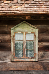 Windows of a wooden cottage