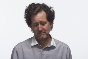 Obraz premium Sad man looking down, horizontal