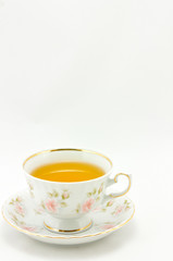 porcelain tea cup full of tea  on a white background