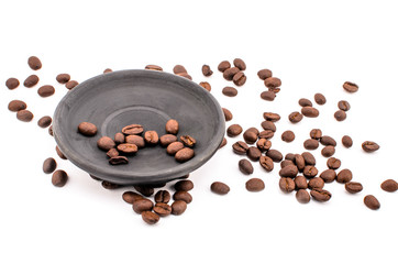 Beans, black saucer isolated background.