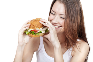 Beautiful young woman holding hamburger