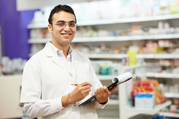 Pharmacy chemist woman in drugstore