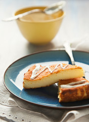 Slices of Baked Ricotta Cake with cream