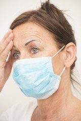 Tired nurse with mask over face