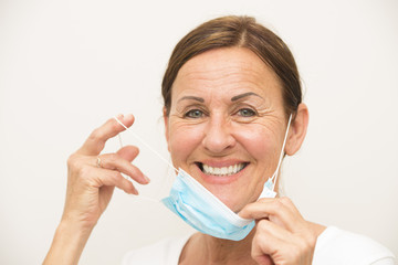 Cheerful female nurse with mask