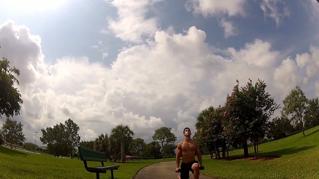 HD: man stretching outdoors - lunge
