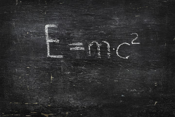 Fototapeta premium Chalk on black board: E=mc2 formula