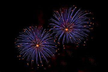 Obraz premium Bursts of Blue and Orange Fireworks