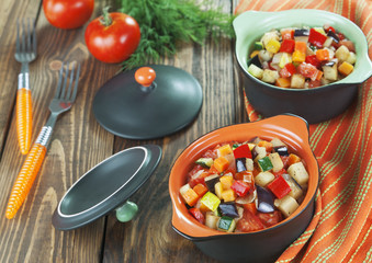 Steamed vegetables in pots portioned