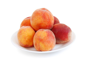 Fototapeta na wymiar several peaches on a plate