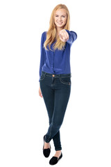 Slender woman pointing at the camera