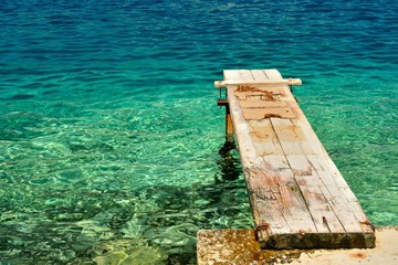 Wooden pier over beautiful adriatic sea. Korcula, Croatia