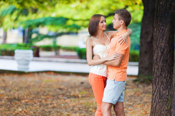 Fototapeta premium Happy young couple in love at the autumn park