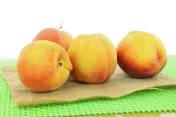peach fruits in white background closeup