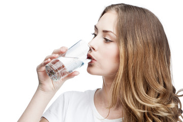 young beautiful brunette woman drinking water