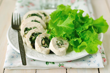 Chicken fillet rolls stuffed with fresh greens, cheese and nuts