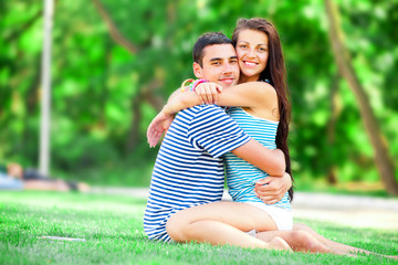 Fototapeta premium Young teen couple kissing at outdoor