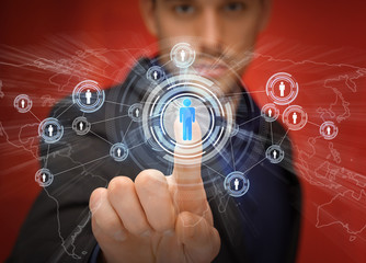 businessman pressing button with contact