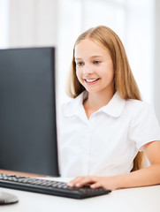 student girl with computer at school
