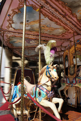 Fototapeta na wymiar Jazda konna na karuzeli Merry-go-round