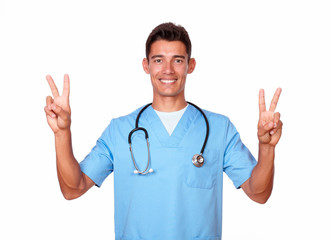 Stylish nurse in uniform gesturing victory