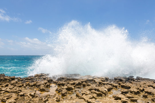 Waves Crashing Over Limestone Coastline
