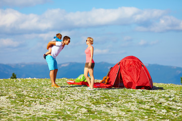 happy family camping in mountains
