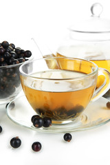 Cup of berry tea isolated on white