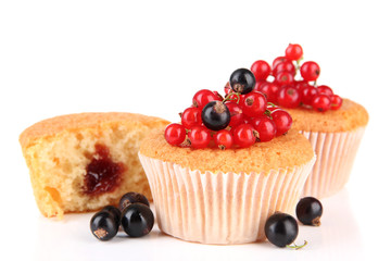 Tasty muffins with berries isolated on white