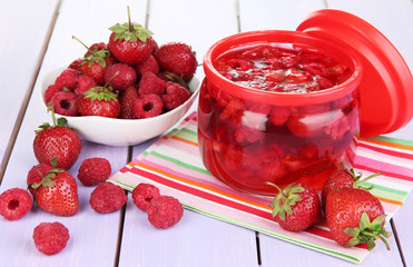 Home made berry jam on wooden table