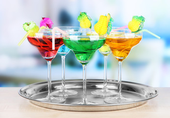 Different cocktails on bright background