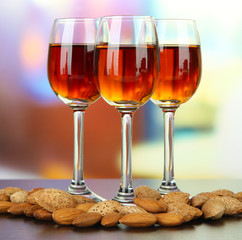 Glasses of amaretto liquor and roasted almonds,