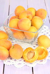 Fresh natural apricot in bowl on wooden table