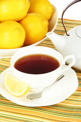 Cup of tea with lemon close-up