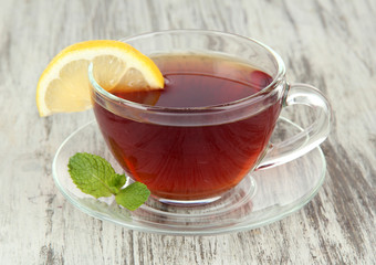 Cup of tea with lemon on table close-up