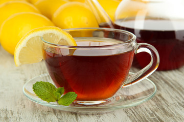 Cup of tea with lemon on table close-up