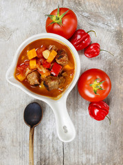Tomato soup with fresh vegetables and meat