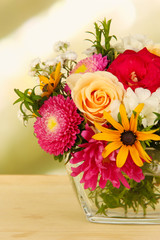 Fototapeta premium Beautiful bouquet of bright flowers in glass vase,