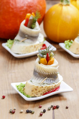 Pickled herring rolls with vegetables