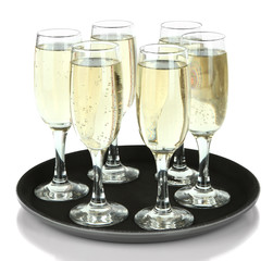 Many glasses of champagne on the tray, isolated on white
