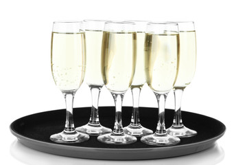Many glasses of champagne on the tray, isolated on white