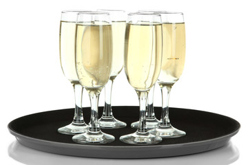 Many glasses of champagne on the tray, isolated on white
