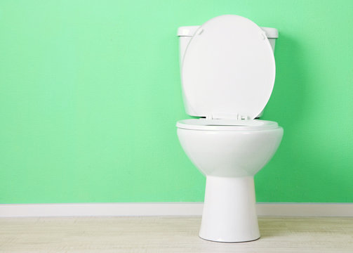 White Toilet Bowl In A Bathroom