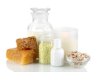 Honey and milk spa with oils and honey isolated on white