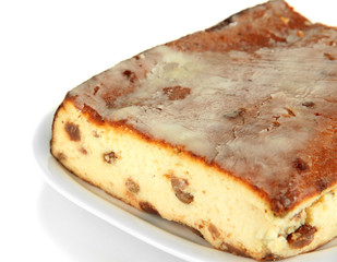 Cheese casserole with raisins on plate isolated on white