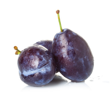 Group of plums isolated on a white background.